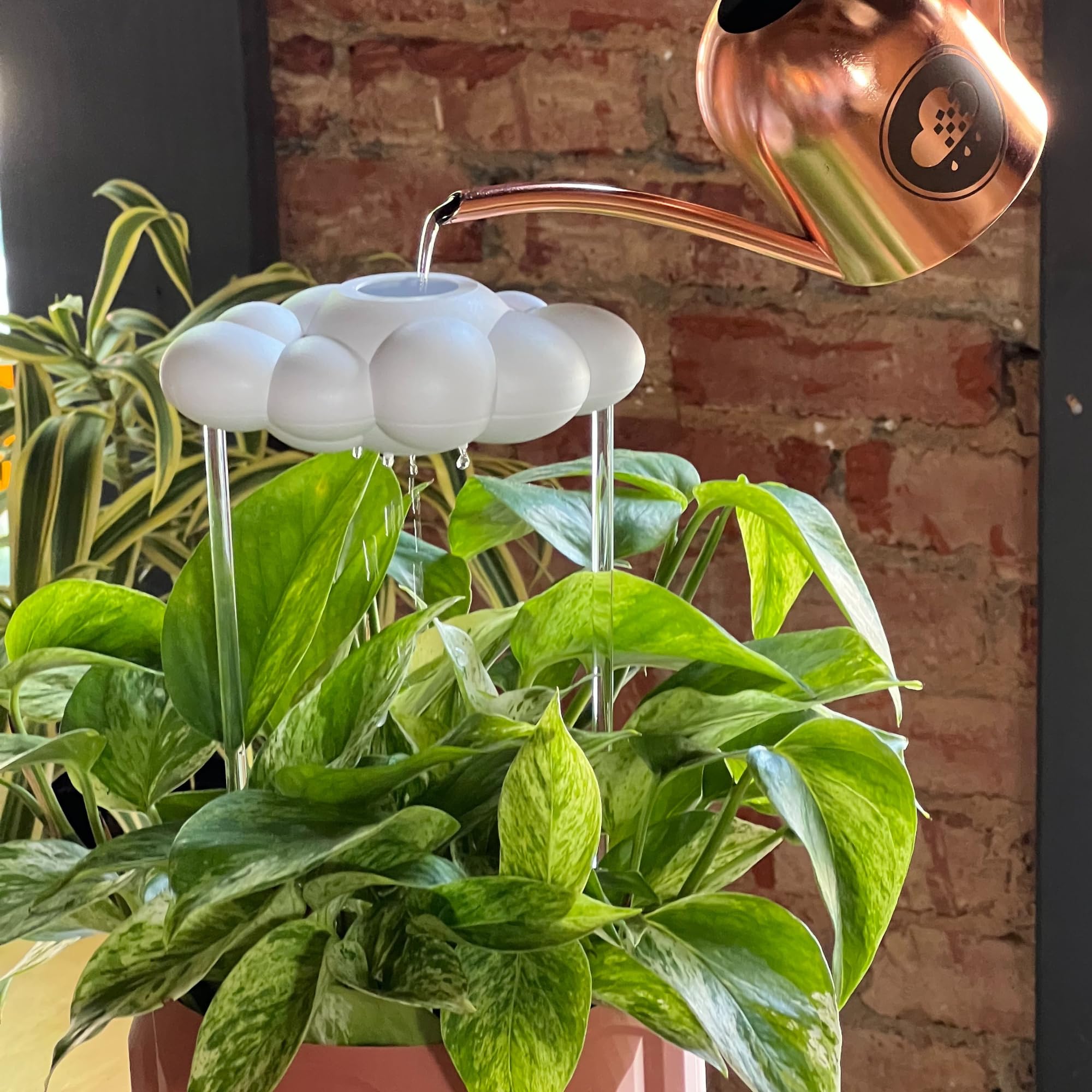 The Cloud Makers Dripping Rain Cloud with clear rod design enhancing décor and function
