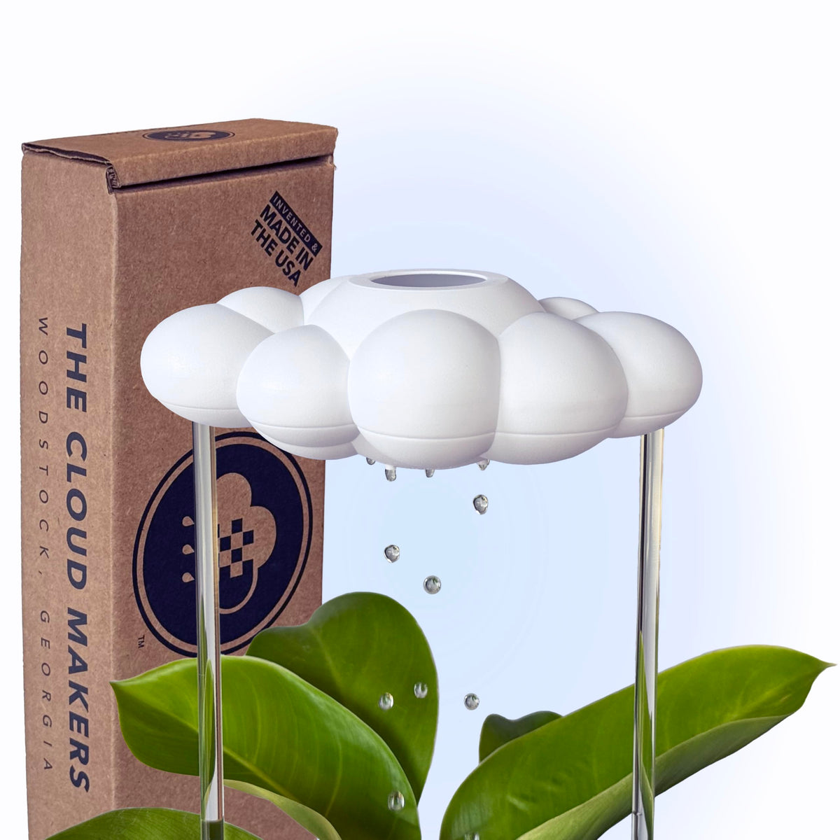 The Cloud Makers Dripping Rain Cloud over a plant pot for gentle, controlled watering