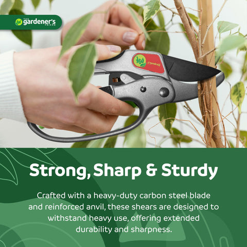 The Gardener's Friend pruner used in a garden bed for trimming.