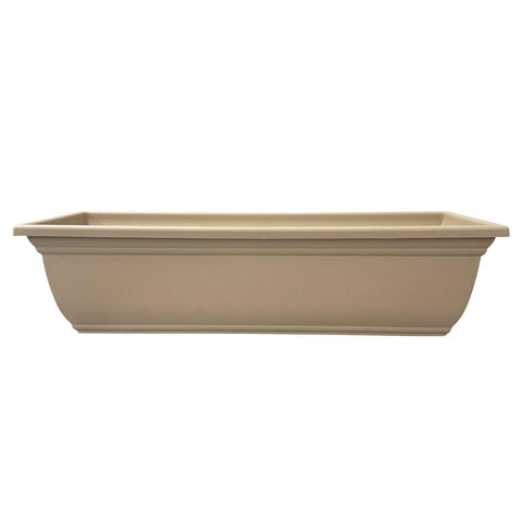 The HC Mojave planter sandstone finish enhances outdoor decor.