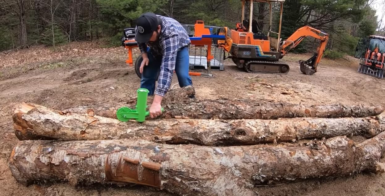The Mingo Marker in use on a stack of firewood showing efficient outdoor marking