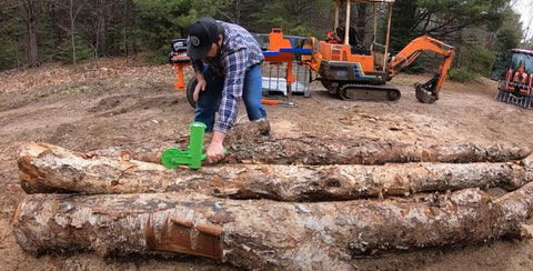 The Mingo Marker in use on a stack of firewood showing efficient outdoor marking