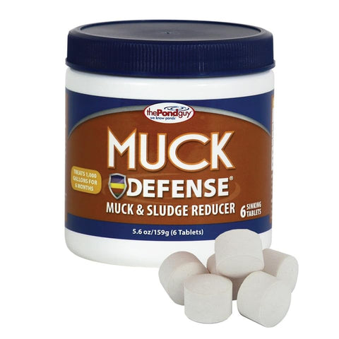 The Pond Guy Muck Defense tablet dissolving to digest pond muck naturally