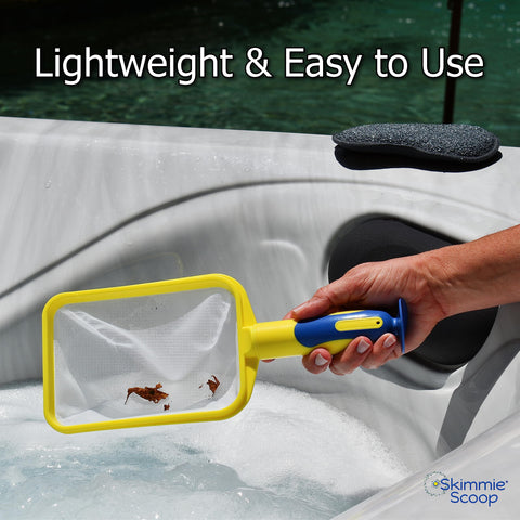 The Skimmie Scoop suction cup attached to a smooth spa wall for hands-free use