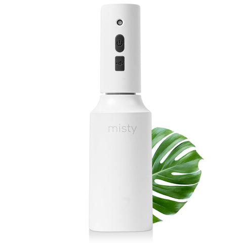 The Watering Vine Mist-E plant mister releasing a gentle ultra-fine mist for indoor plants.