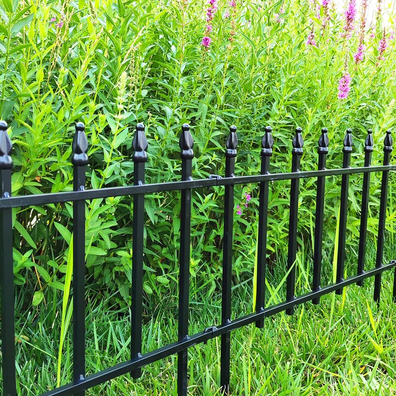 Thealyn folding fence panel forms a curved barrier around a yard area.