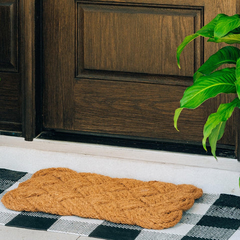 THEODORE MAGNUS door mat shows durable coir fiber texture for high-traffic areas.