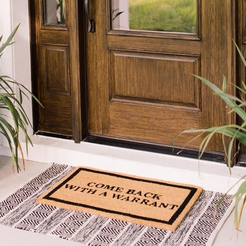 Theodore Magnus door mat features non-slip backing to help keep entryways safe.