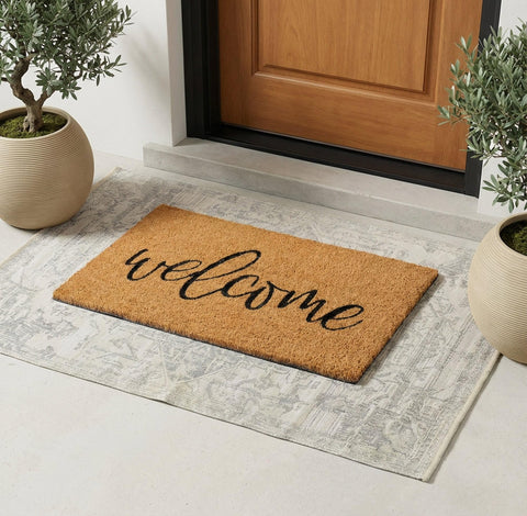 Theodore Magnus doormat close-up highlights non-slip backing for secure placement