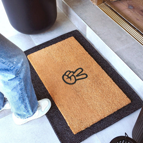 THEODORE MAGNUS door mat non-slip backing keeps mats secure in high-traffic entrances.