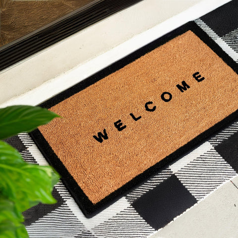Theodore Magnus welcome mat border design enhances curb appeal and entryway style.