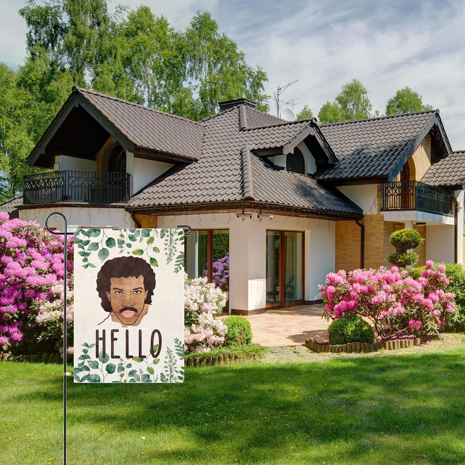 Thriano Hello Funny Garden Flag fluttering in the breeze brightens the garden.