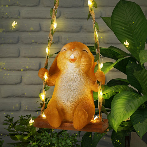Thyle solar light outdoor Easter bunny statue on swing illuminates yards with warm ambience