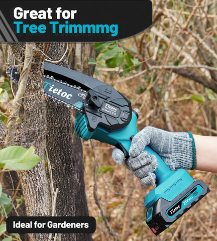 Tietoc mini chainsaw pruning in a field, portable outdoor use