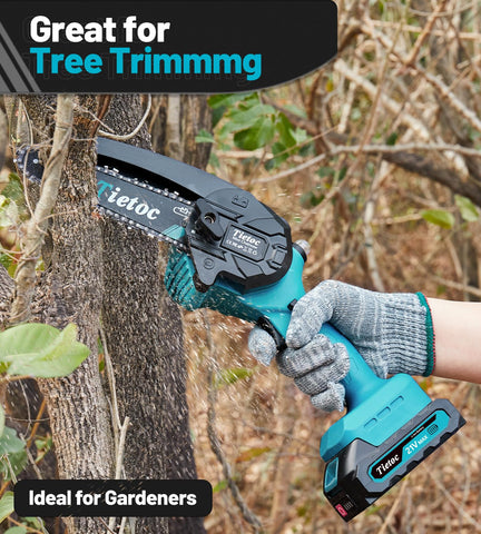 Tietoc mini chainsaw in use outdoors for branch pruning and cleanup