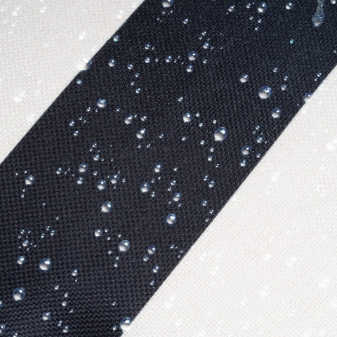 Outdoor garden scene with Tiggell pillow cover showing water beads rolling off.