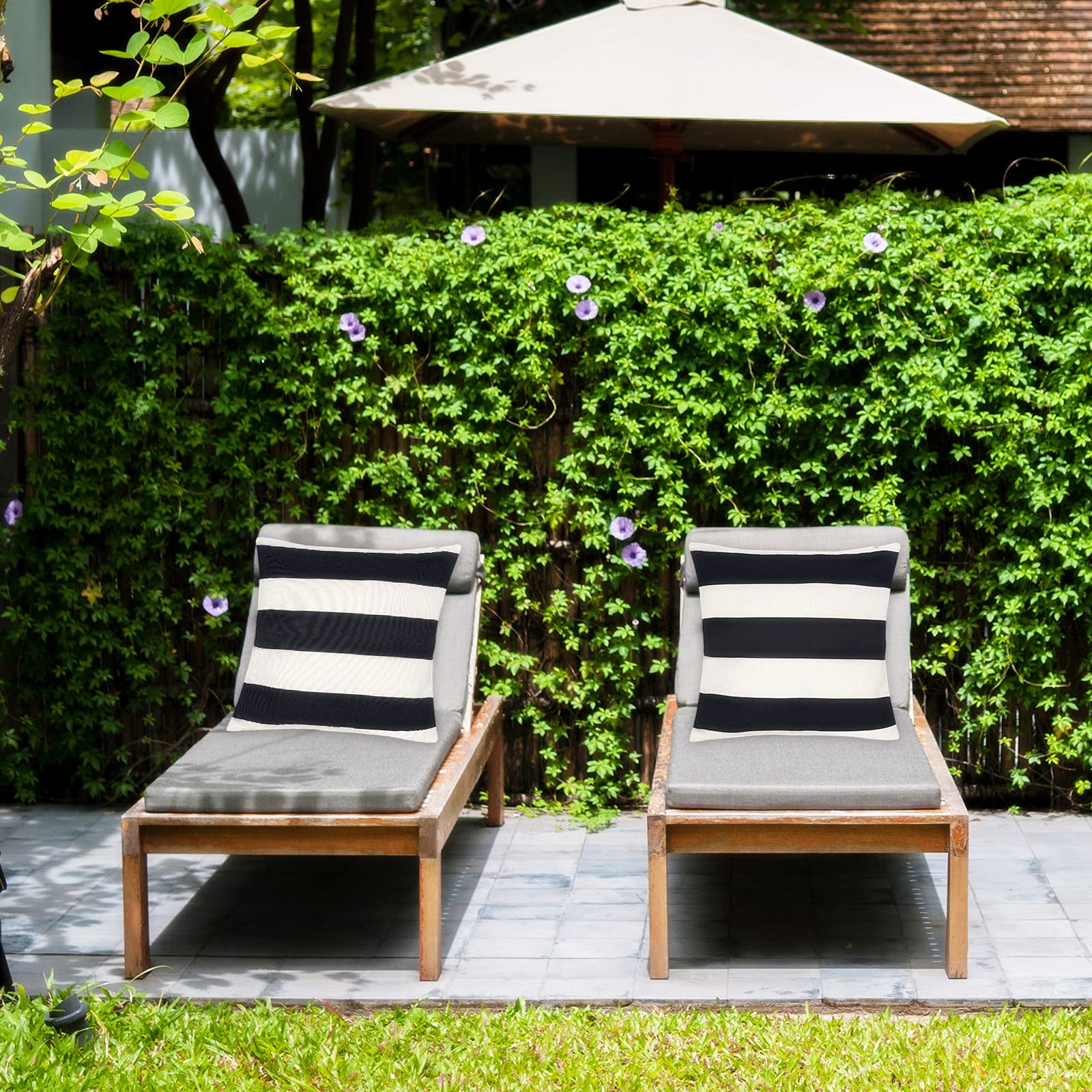 Tiggell striped black and white cushion cover for balcony furniture.