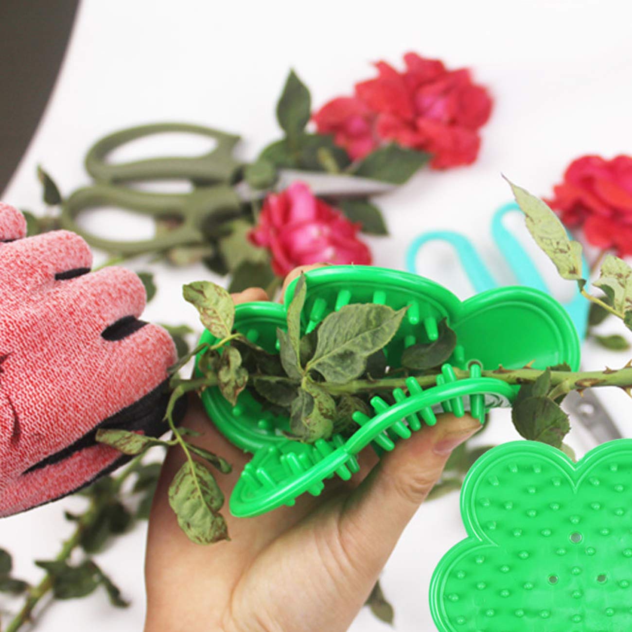 TIHOOD garden glove pair protects hands during pruning and handling.