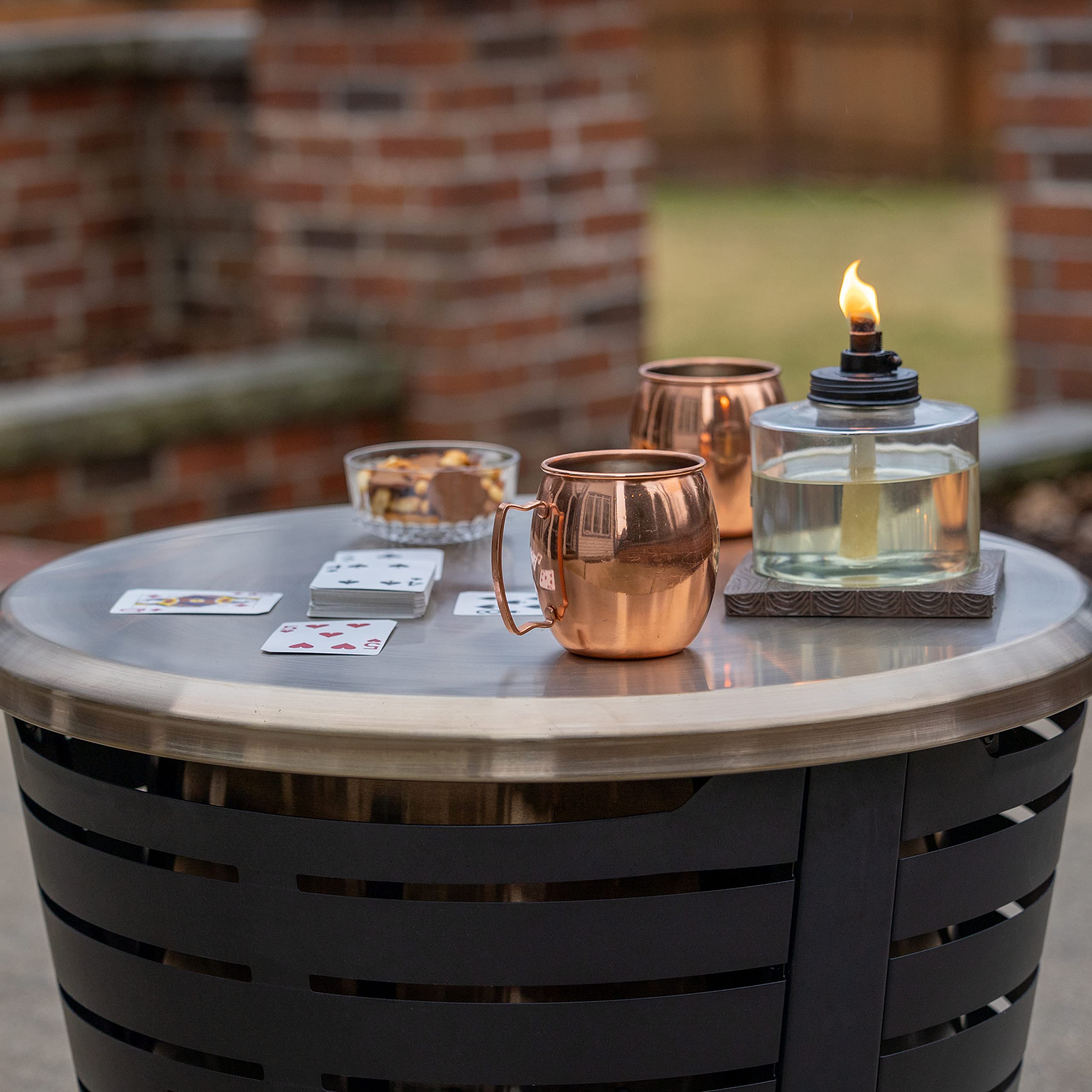 Gold stainless steel tabletop finish adds durable, elegant touch for outdoor entertaining.