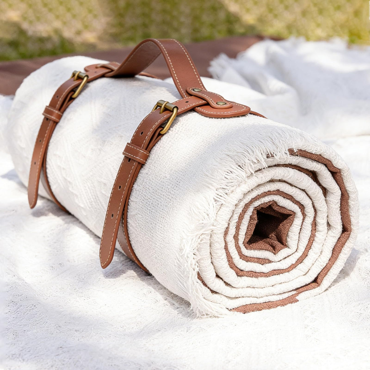 Tiny Land picnic blanket with waterproof cushion for damp grass use.
