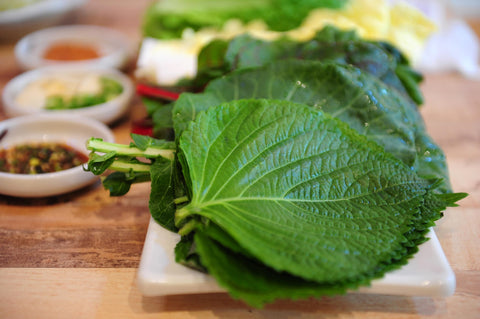 Shiso leaves on a sushi plate for authentic flavor from TKE Farms & Gardens.
