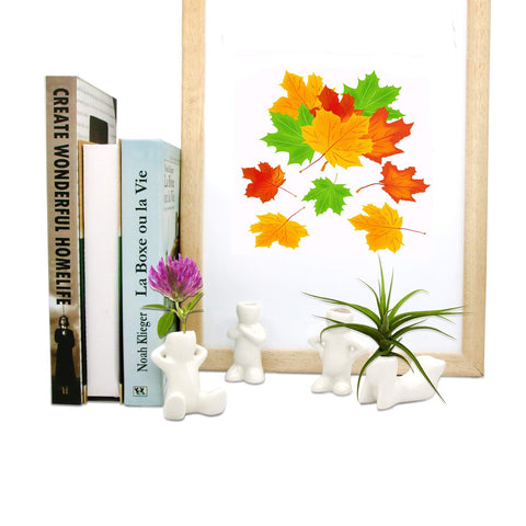 Together-life air head planters on a desk offer a playful accent.