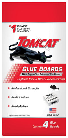 Tomcat Glue Boards catching cockroaches and spiders in a corner.