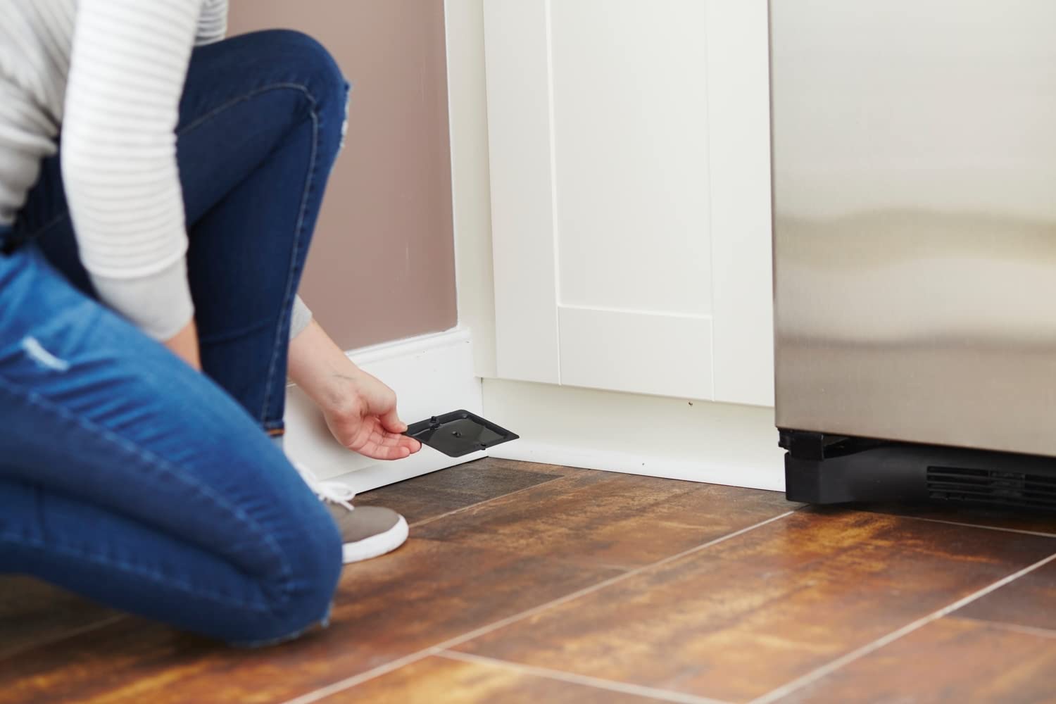 Tomcat glue trap on the wall for targeted pest attention.