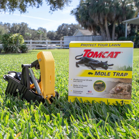 Tomcat Mole Trap yellow foot pedal enables quick, surface-free activation.