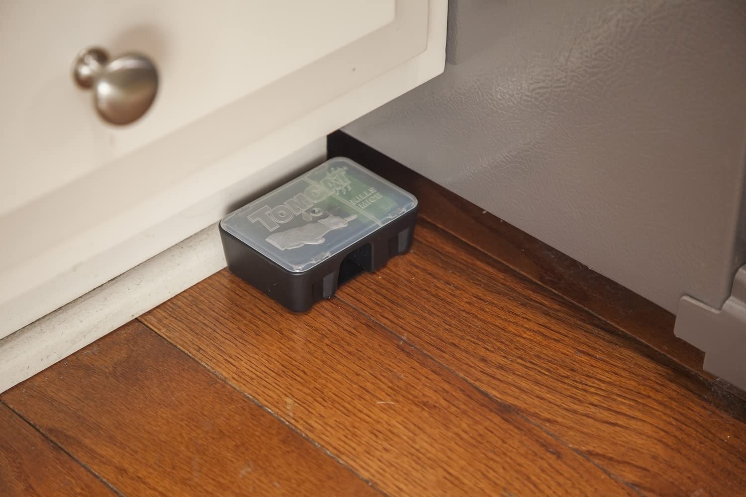 Tomcat station installed in an indoor corner for pest control.