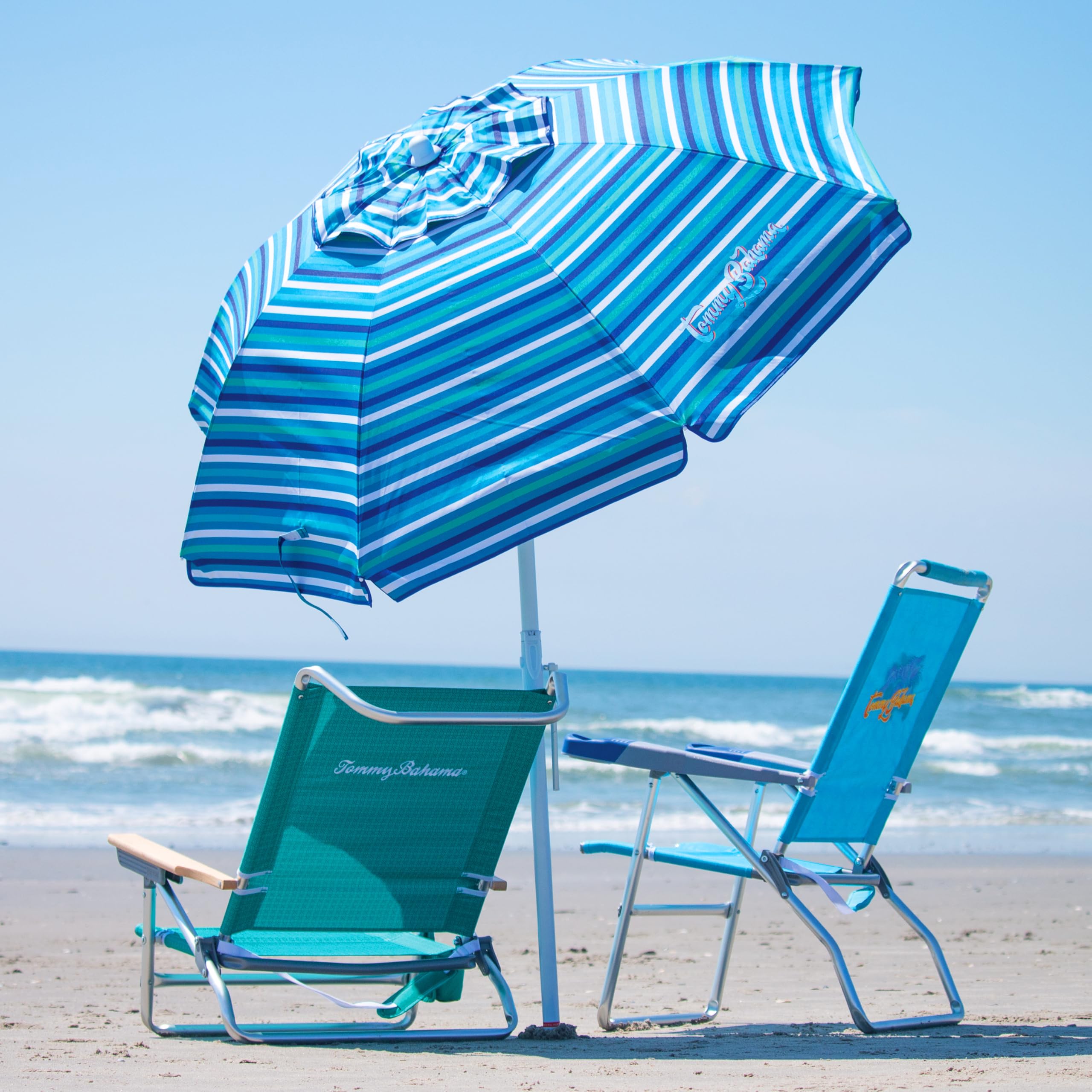 Tommy Bahama sand anchor system secures umbrella on the beach
