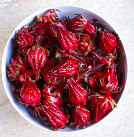 TomorrowSeeds Roselle harvest-ready calyces add color to jams and syrups.