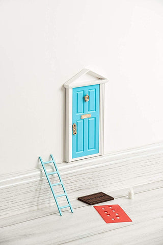 Tonttuovi fairy door on the wall with open panel for imaginative play and note exchanges.