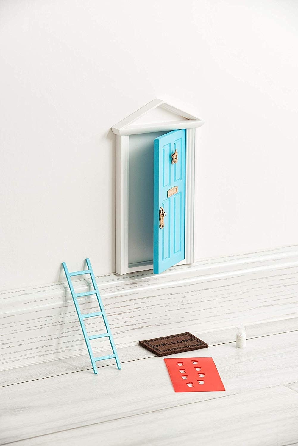 Tonttuovi tooth fairy door with a mini ladder set for playful tooth rituals and durable use.