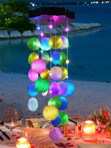 Toodour solar wind chimes outside with seashells and lights for tranquil evenings.