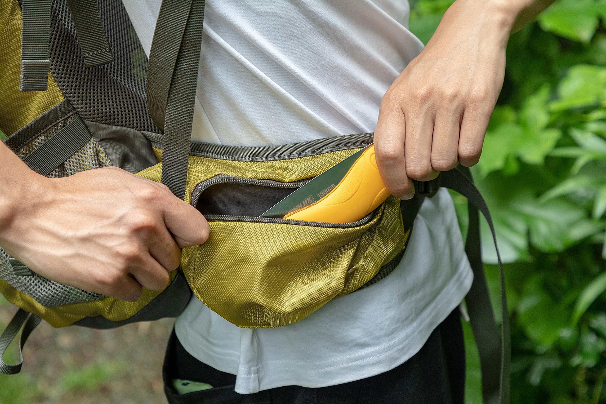 Toolux wood-cutting action shown during outdoor use.