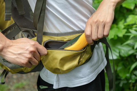Toolux wood-cutting action shown during outdoor use.