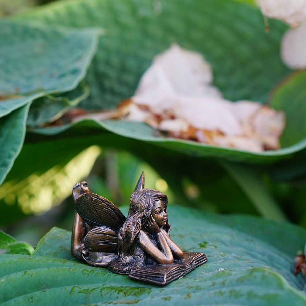 Top Collection 4386 bronze fairy reading statue detail enhancing visual storytelling