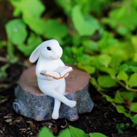 Top Collection fairy garden bunny reading on stump statue with hand-painted detail for terrarium decor.