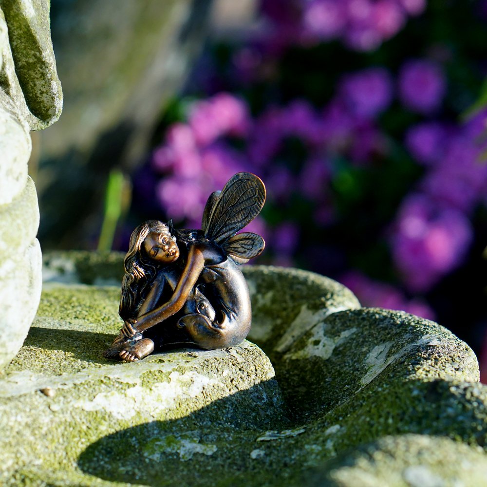Small sleeping fairy ornament ideal for pots, terrariums, and fairy garden displays.
