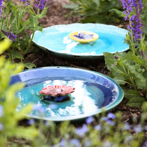 Topadorn Birdbath outdoor decor doubles as garden accent.