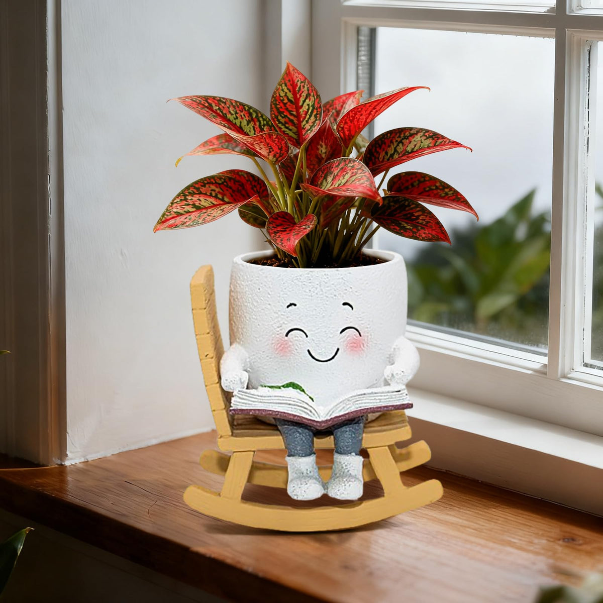 Toparad Smiley Face Rocking Chair Planter on a shelf with small succulents.