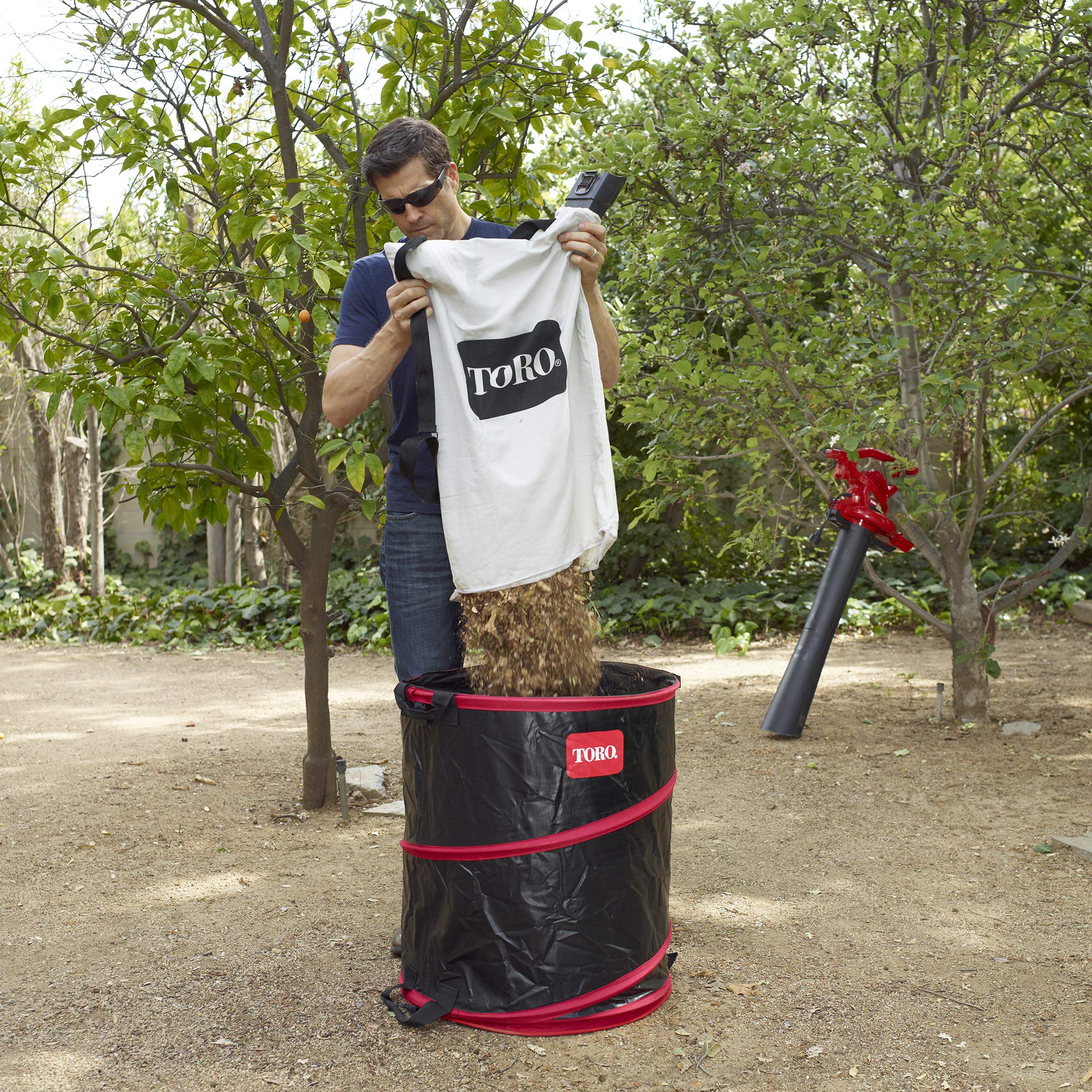 Toro 51503 white bag showing bottom zipper for durable, simple emptying.