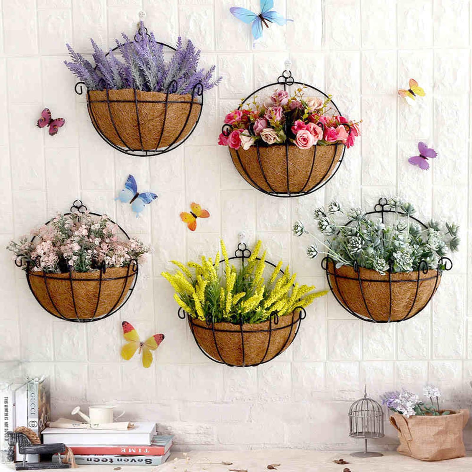Tosnail planter supports living flowers, grasses, and succulents.