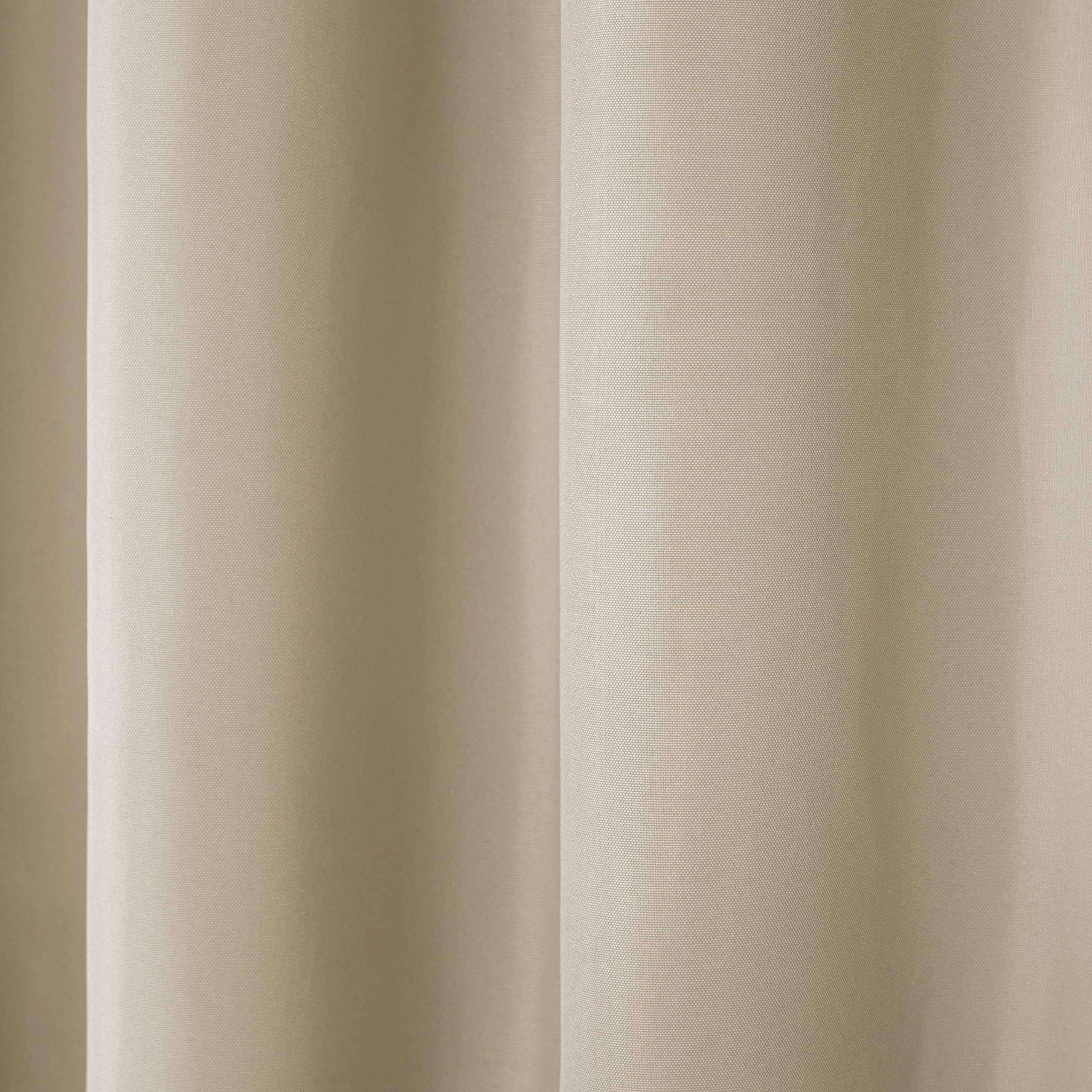 Town and Country Basics Cabana curtains show light filtering for daytime privacy.