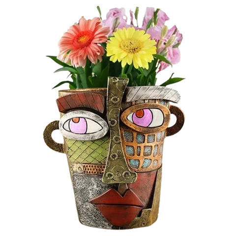 TOZLU abstract face planter pot adds vibrant color to indoor spaces.