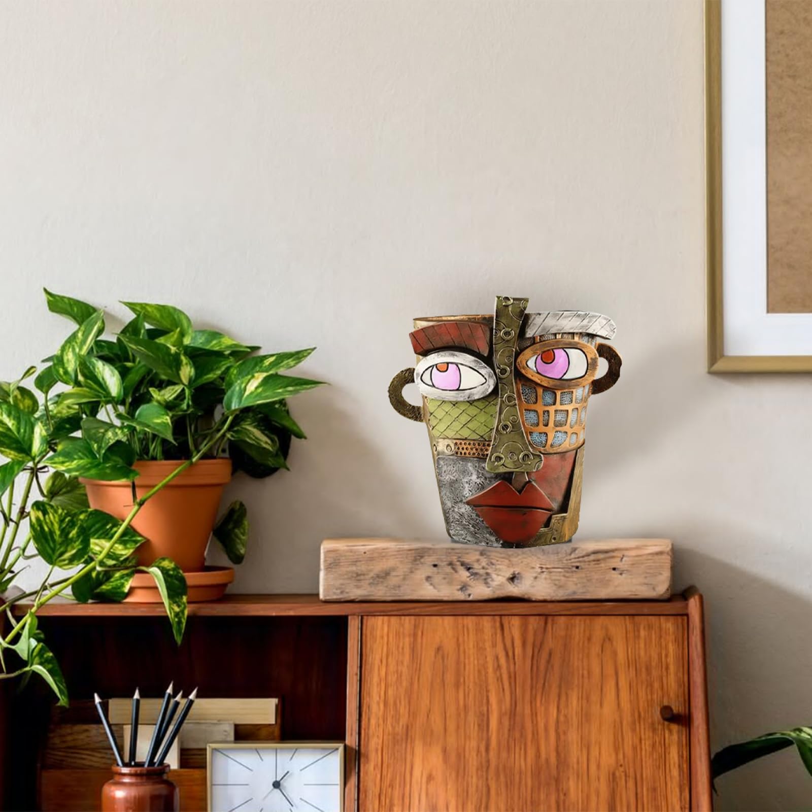 TOZLU artful face planter blends sculpture and greenery for unique rooms.