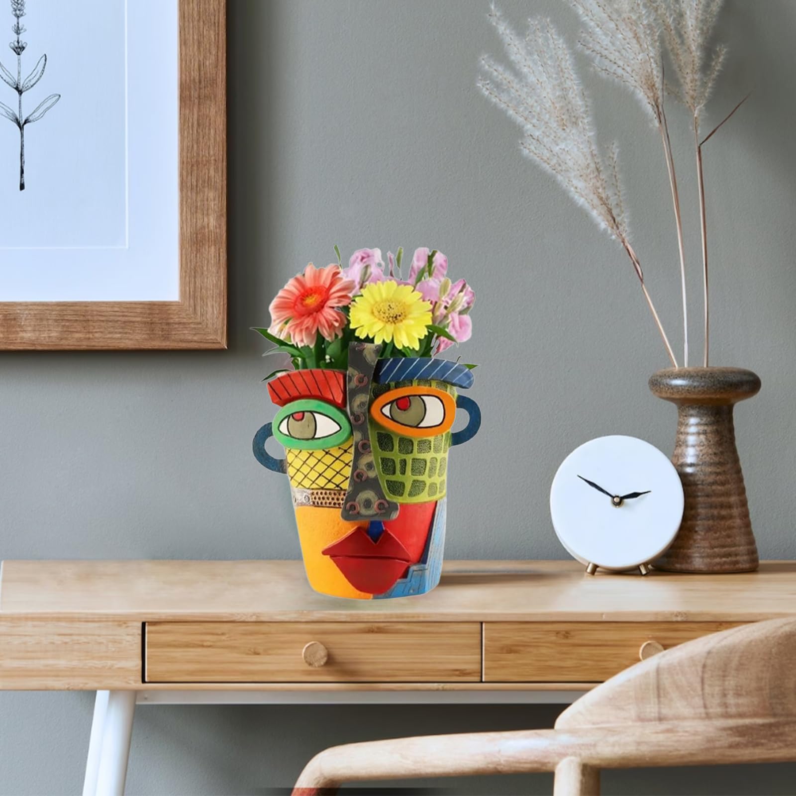 TOZLU brutalist face pot combines art and plants in a durable resin planter.