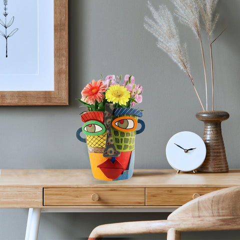 TOZLU brutalist face pot combines art and plants in a durable resin planter.