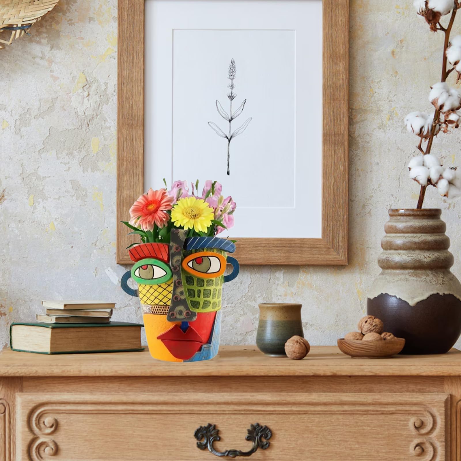 Colorful Picasso inspired head planter as a modern sculpture and plant container.